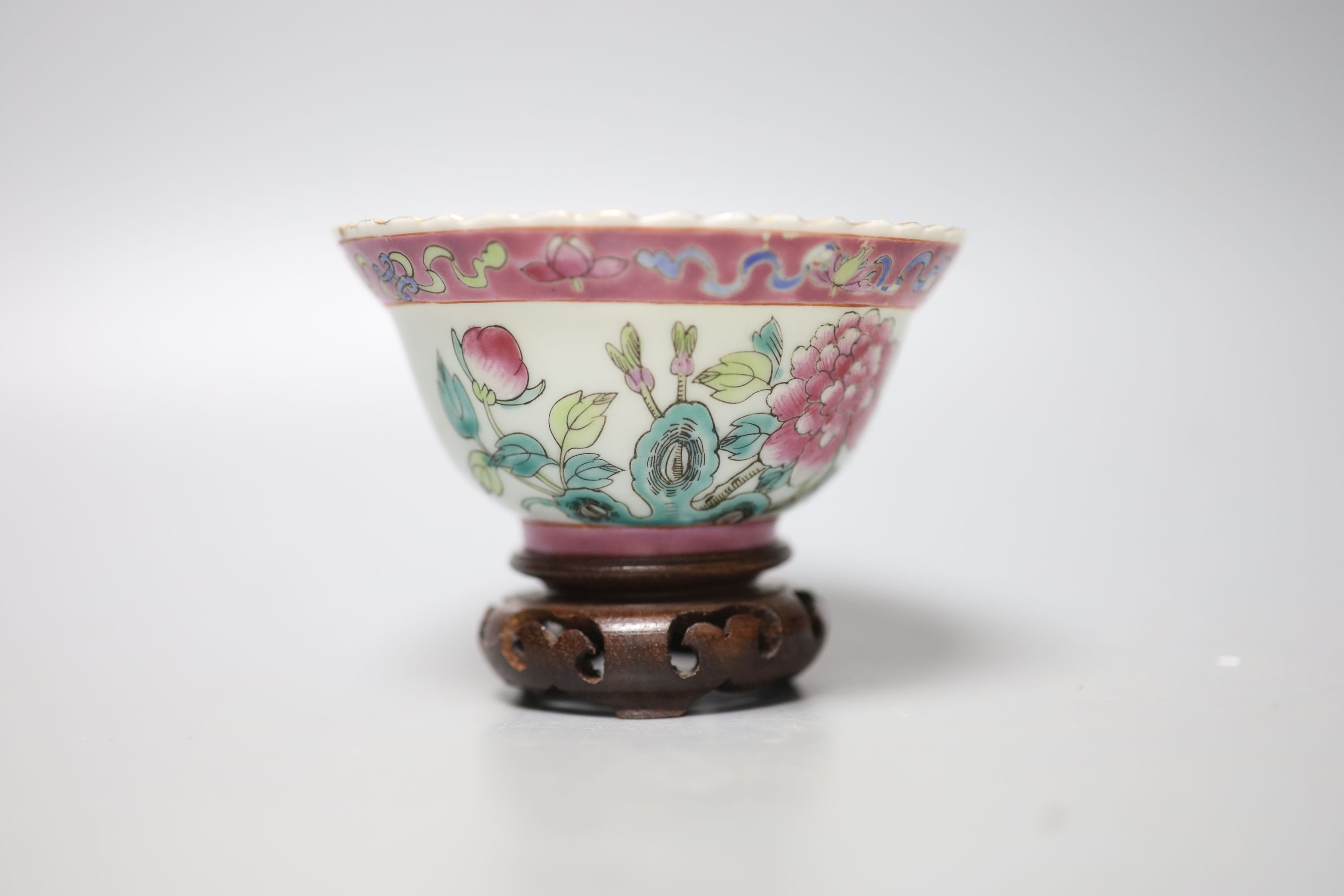 A Chinese Straits famille rose ‘dragon’ bowl, 11cm, and a carved wood figure of a Budai, 28cm